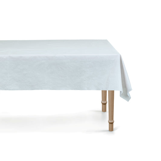 Light Blue Tablecloth tablecloth on a wooden table with a white background