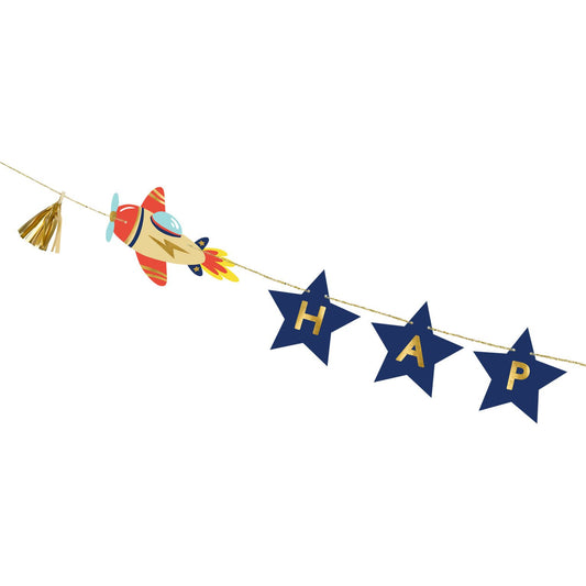 Birthday banner with "Happy Birthday" text on navy blue stars, decorated with rocket illustrations.