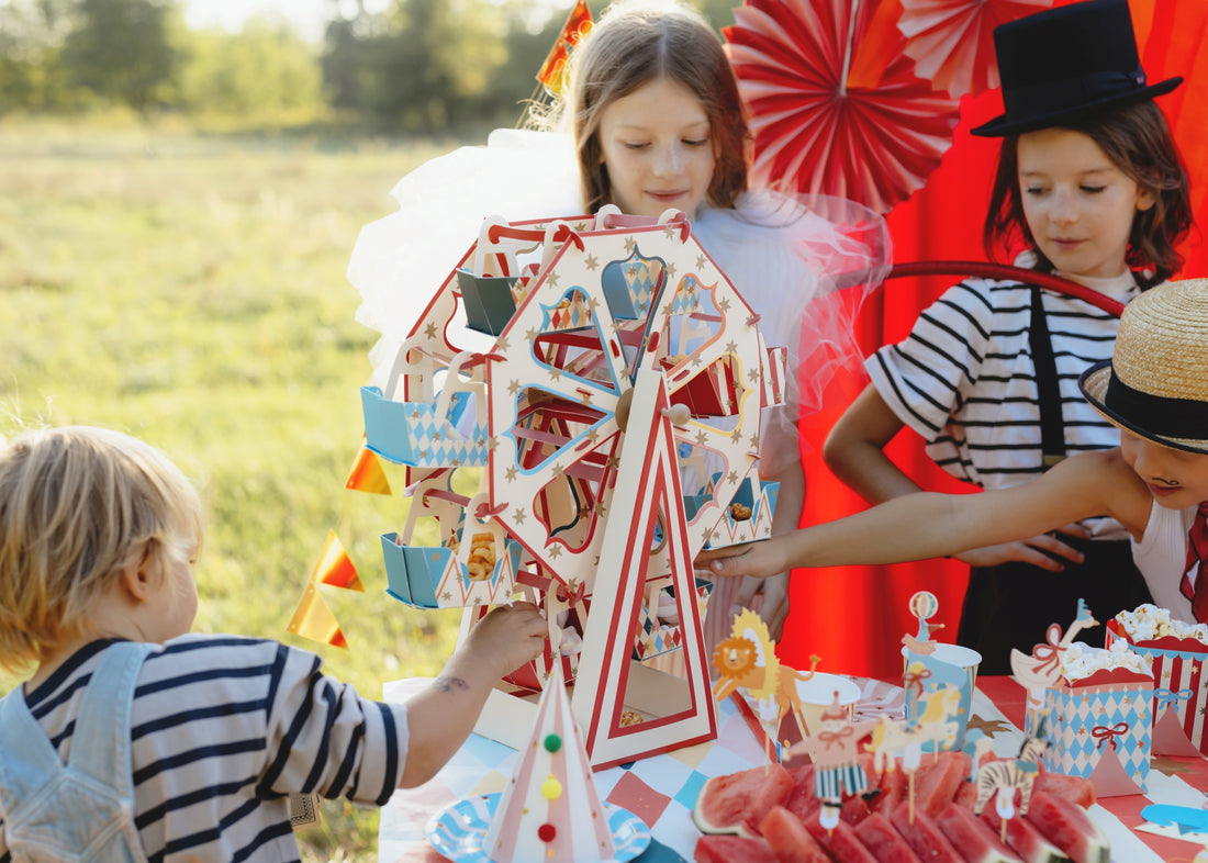 Children enjoying popcorn at a Ferris Wheel Snack Stand at Magic Circus Party