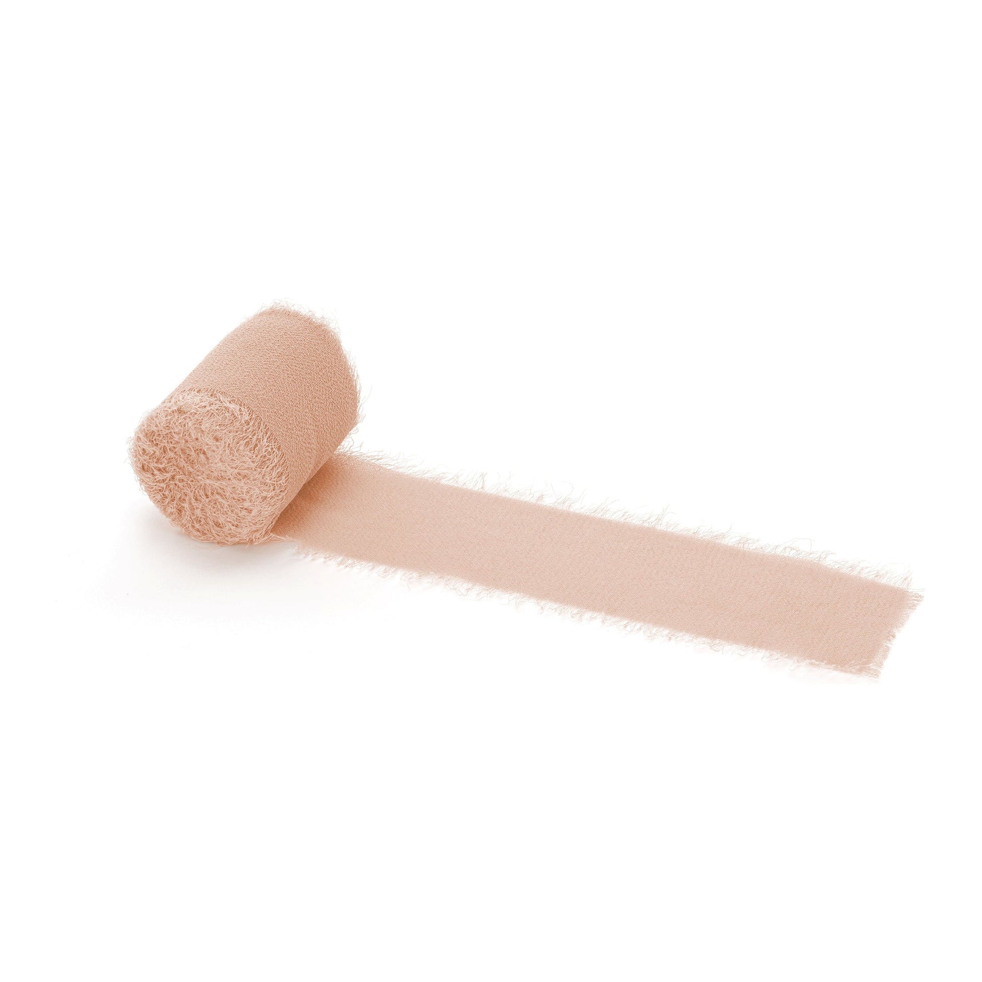 Roll of salmon ribbon on a white background