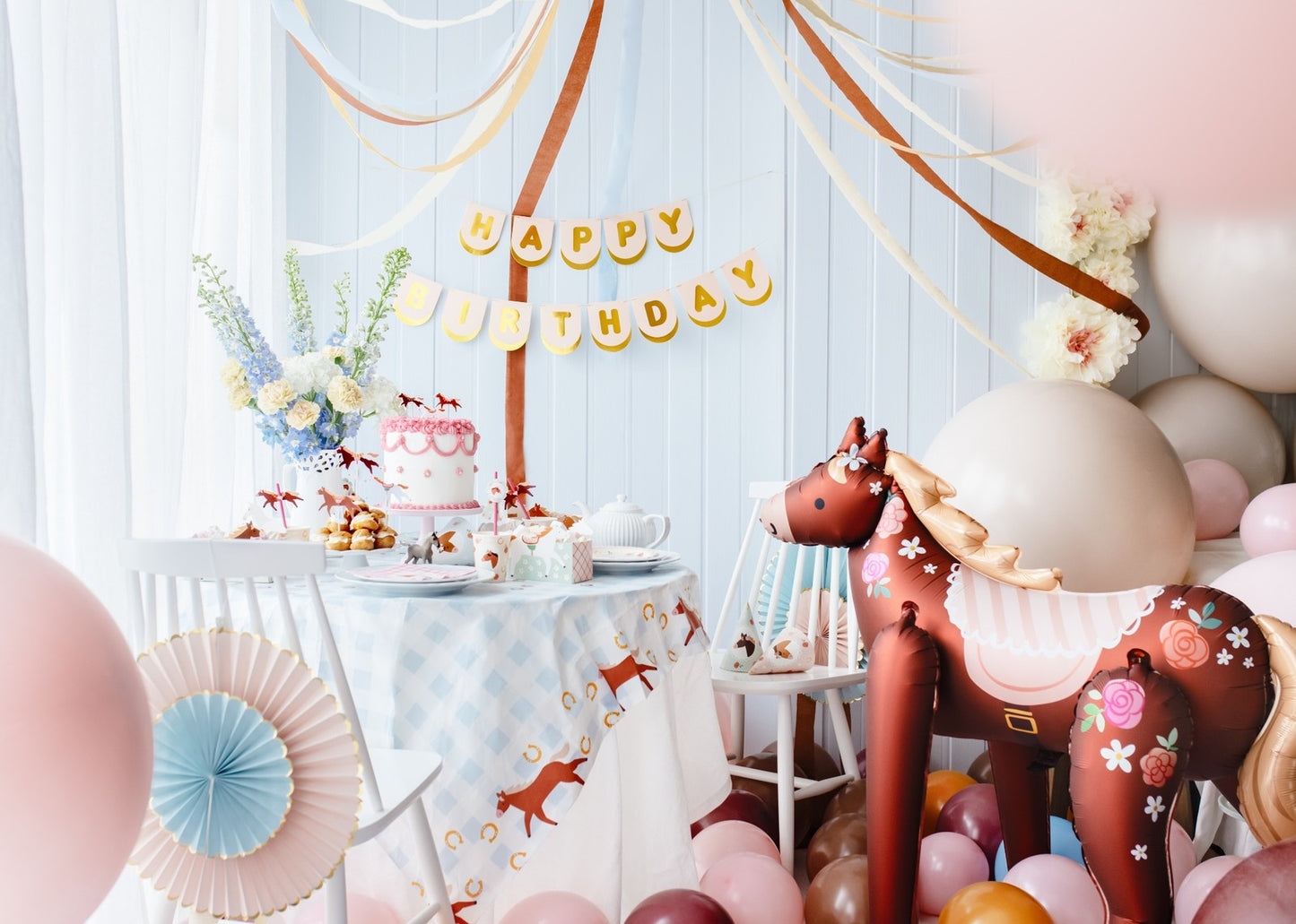 Large standing foil horse balloon with floral design for kids birthday party
