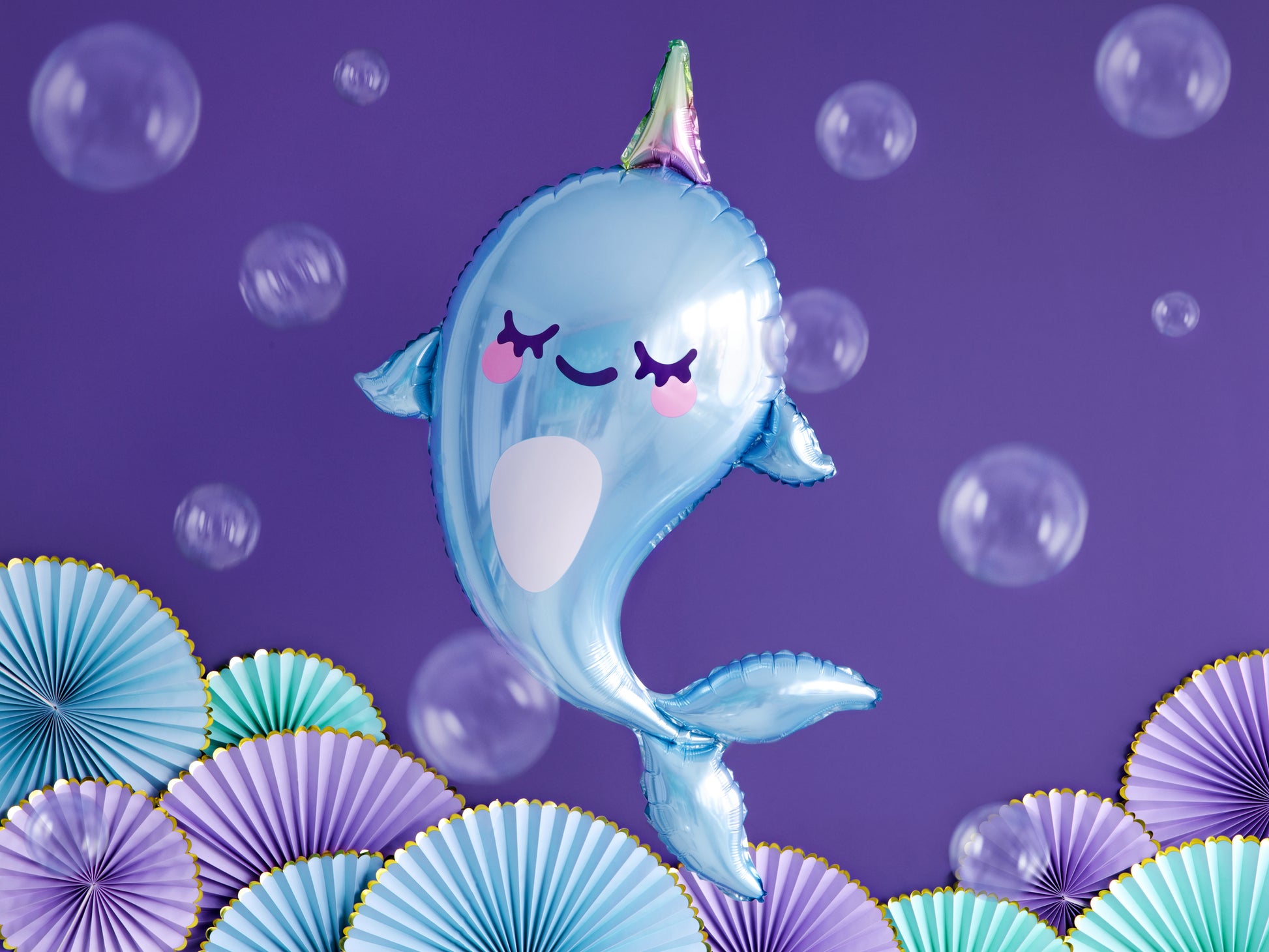Cute blue narwhal foil balloon with a colorful horn — ideal for kids' ocean or mermaid birthday decorations.