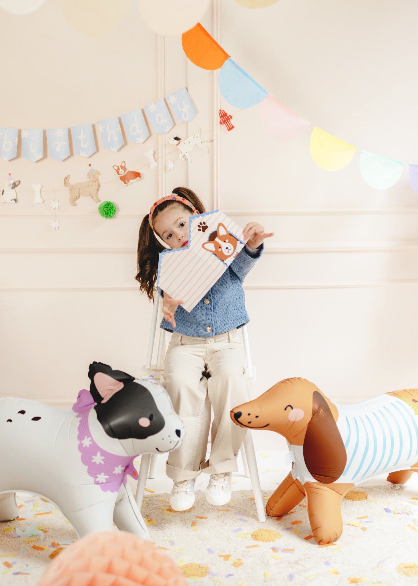 Bulldog-shaped standing foil balloon with black and white spots and purple floral collar, perfect for dog-themed birthday parties and decorations