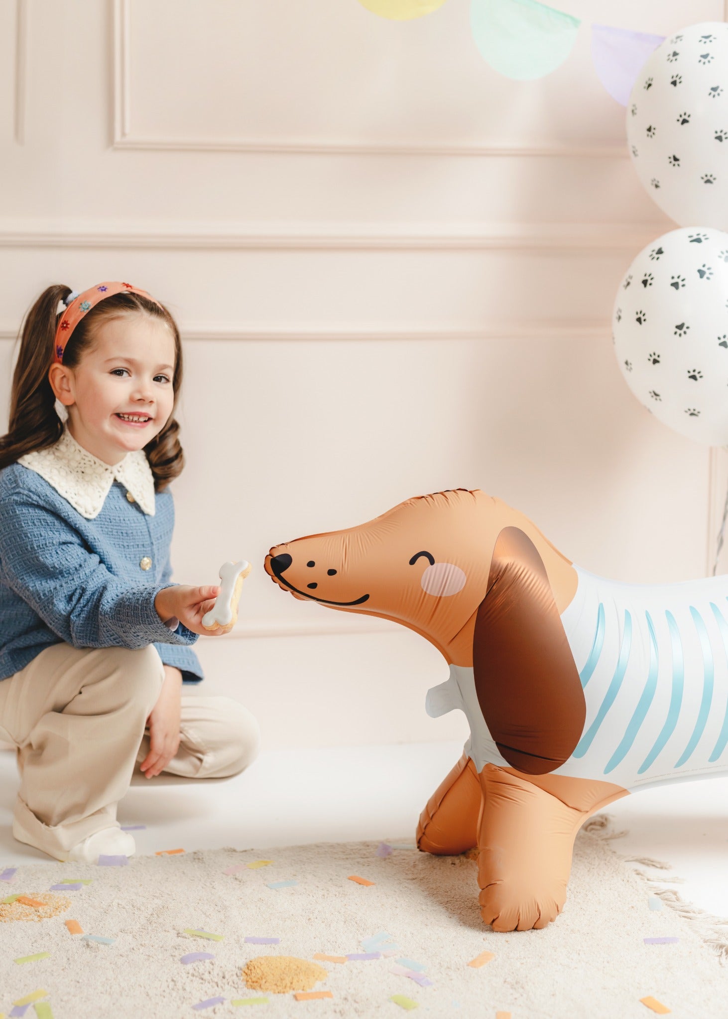 Dachshund-shaped foil balloon wearing a striped shirt, perfect for playful birthday parties, dog-themed events and kids' celebrations