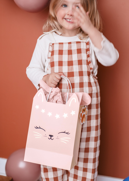 Pink gift bag with cat face and star design, ideal for party favors or birthday gifts for cat-themed celebrations.