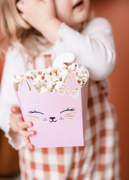 Pastel kitty-themed snack boxes with cute cat faces and gold details, perfect for holding treats at kitty birthday parties or cat-themed celebrations.