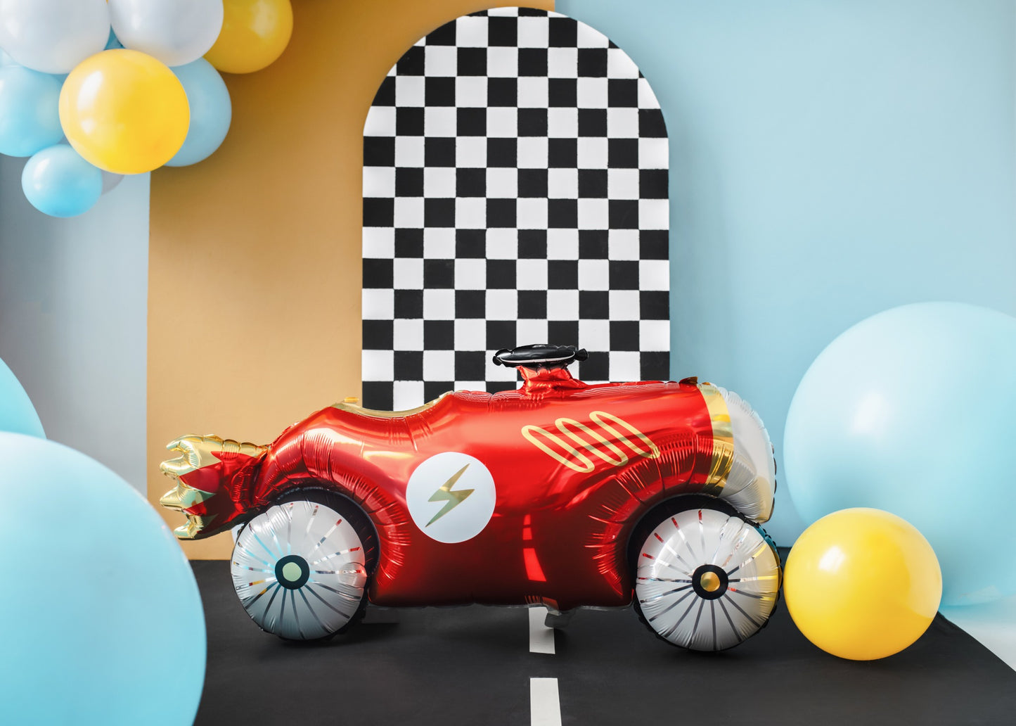 Red race car foil balloon with gold and white accents.