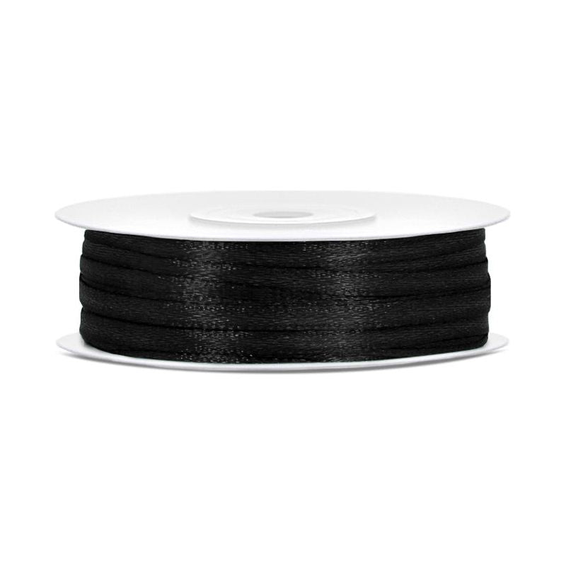 Spool of black ribbon on a white background