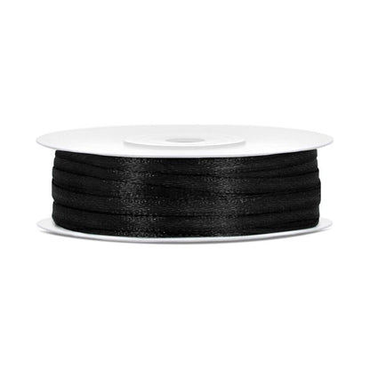 Spool of black ribbon on a white background