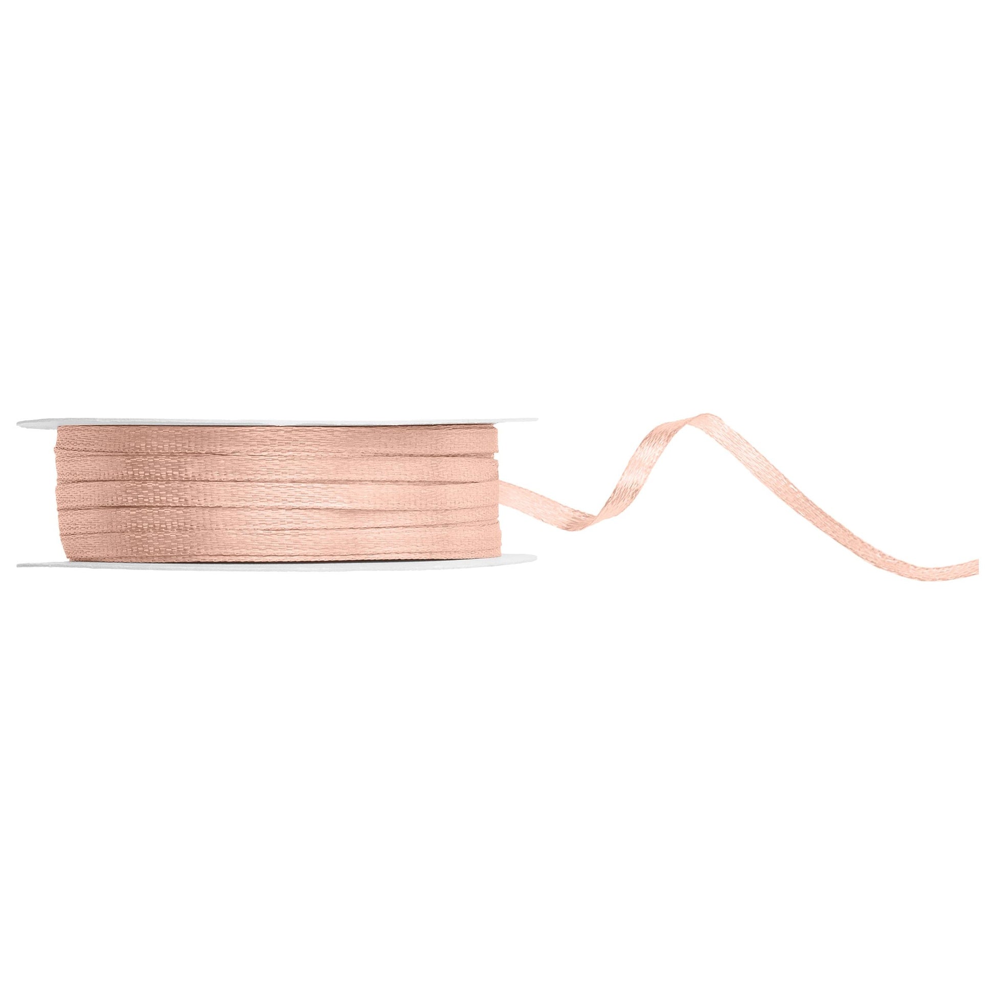 Spool of light peach ribbon on a white background