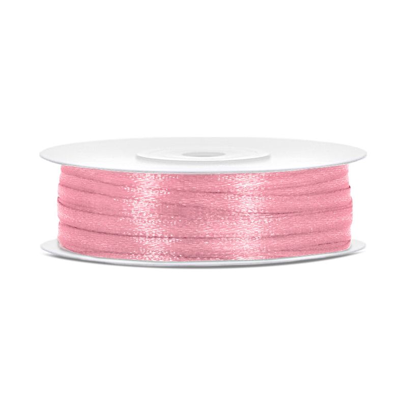 Spool of light pink thread on a white background
