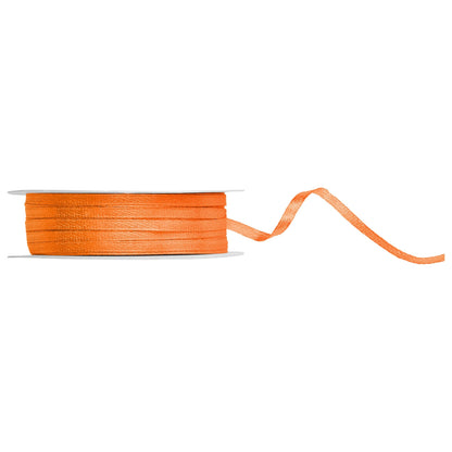 Spool of orange ribbon on a white background