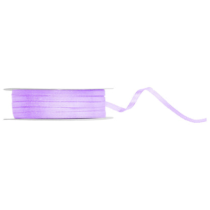 Spool of purple ribbon on a white background