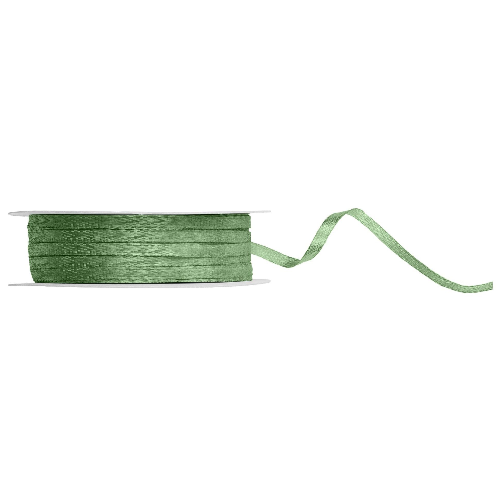 Sage ribbon spool on a white background