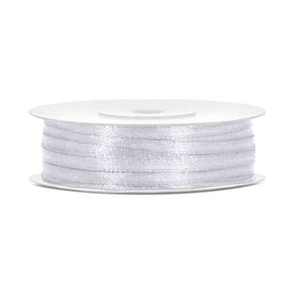 Spool of white thread on a white background
