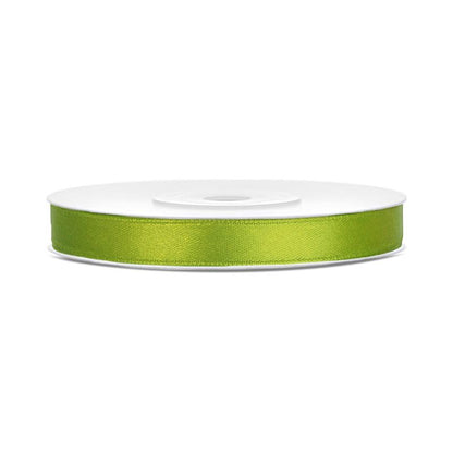 Roll of apple green ribbon on a white background