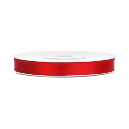 Red satin ribbon on a white background