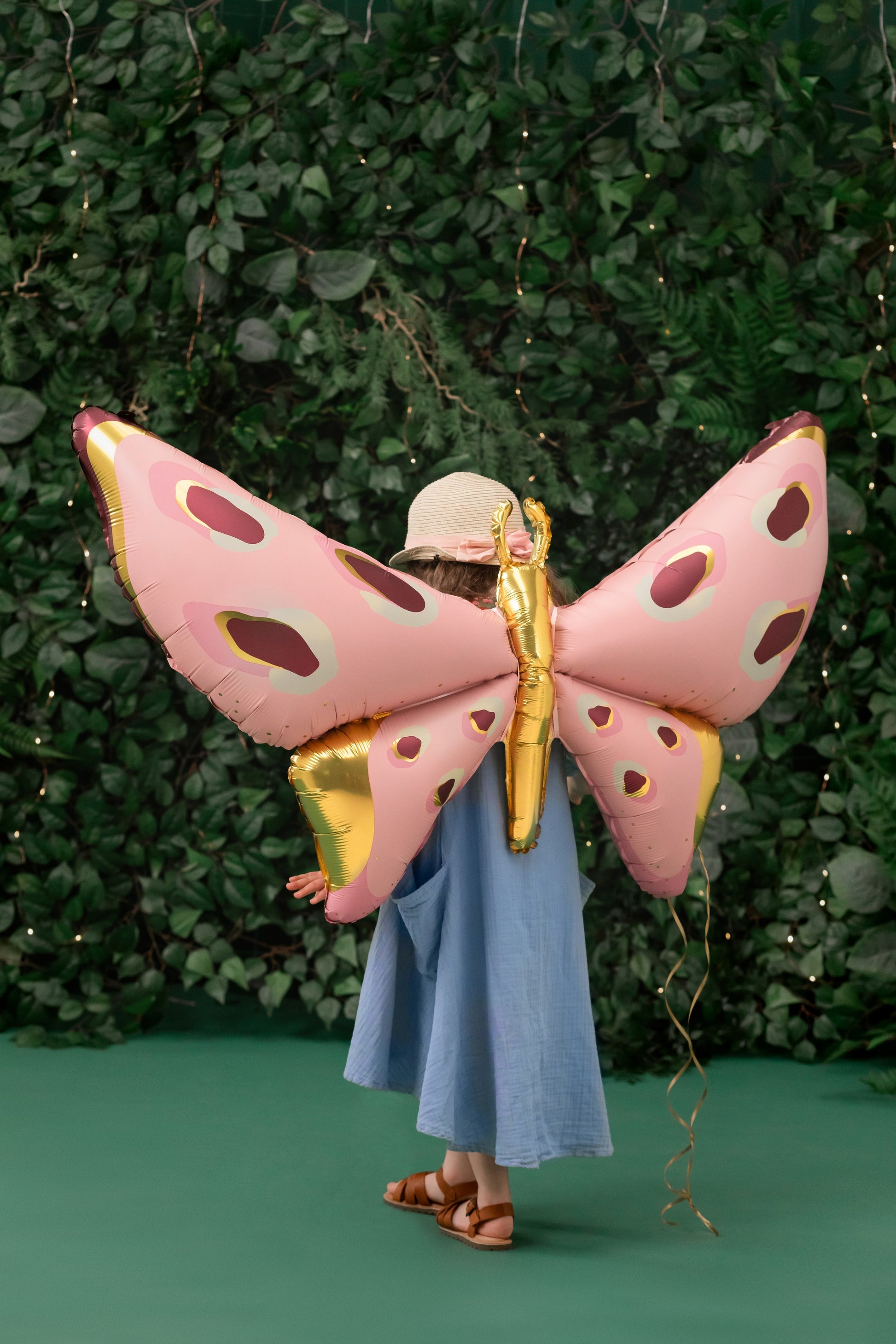 Pink butterfly foil balloon for unicorn birthday party decoration