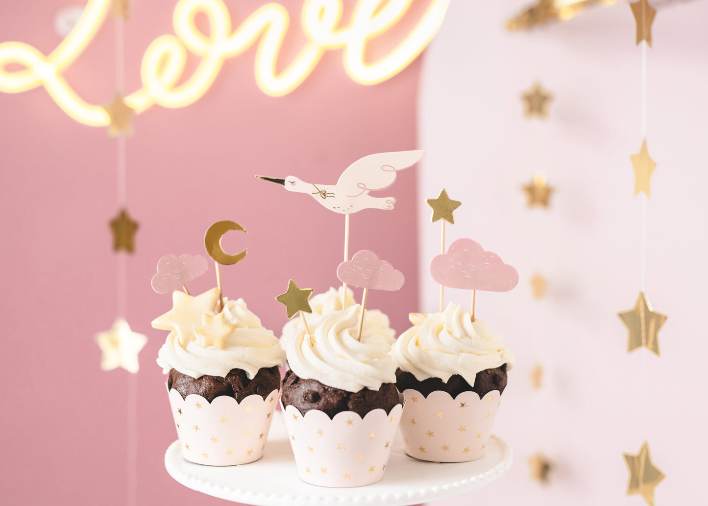 Stork cupcake toppers in soft pastel colors – baby shower or newborn celebration cake decorations