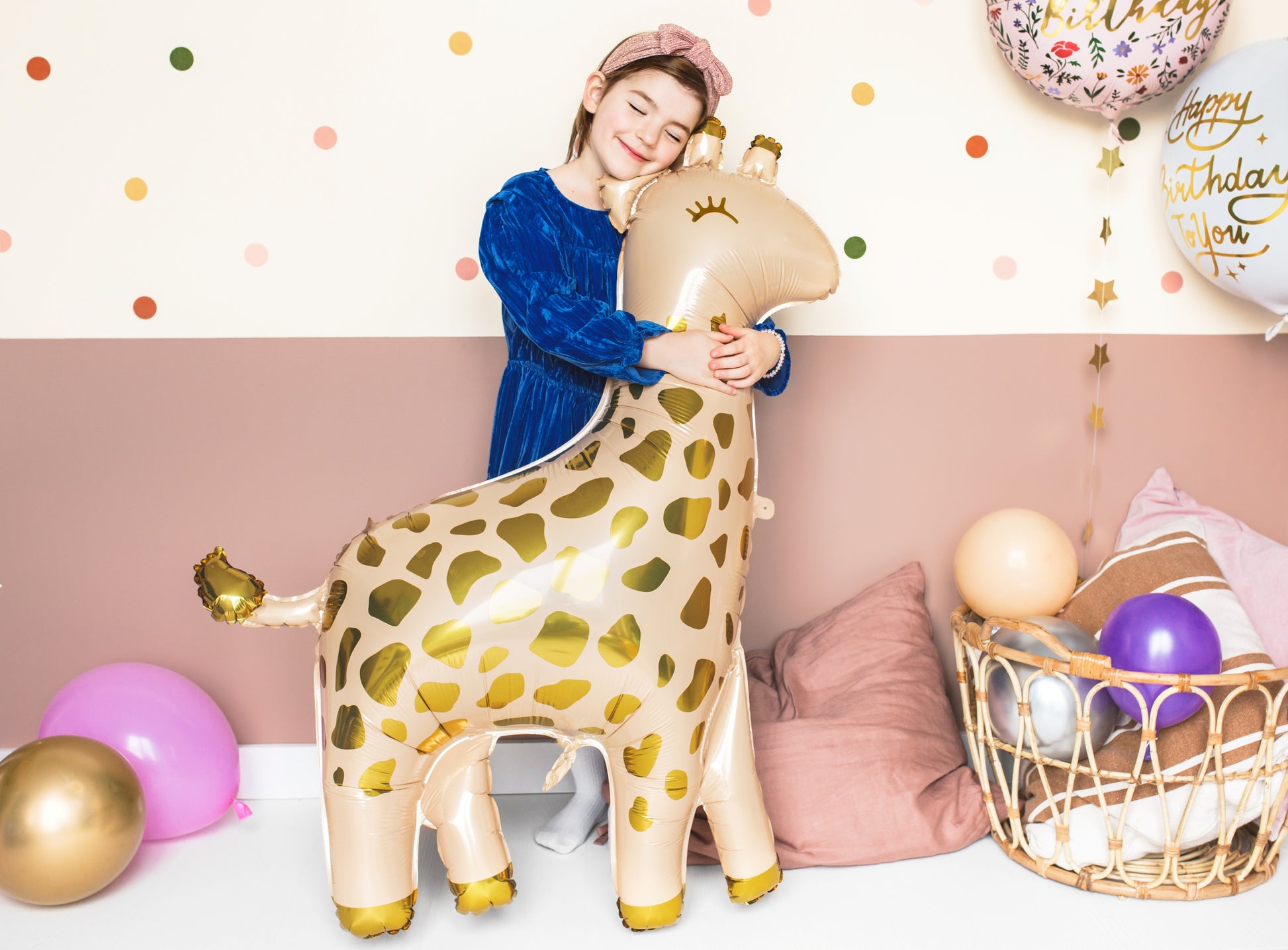 Giraffe-shaped foil balloon with golden spots for safari-themed party
