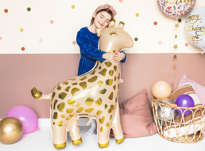 Giraffe-shaped foil balloon with golden spots for safari-themed party
