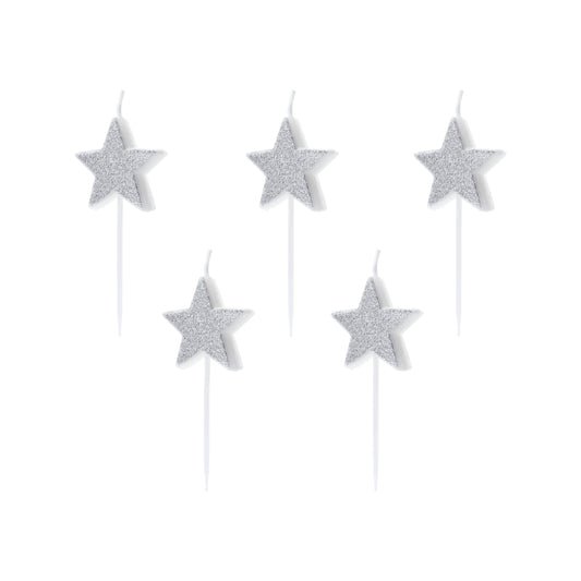 Silver glitter star birthday candles for space-themed cake decor